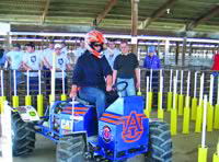 Jennifer Lofty driving AU tractor