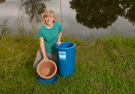 Mollie Smith displays a low-cost ceramic water purifier designed to filter contaminants from water so that it can be used for drinking.