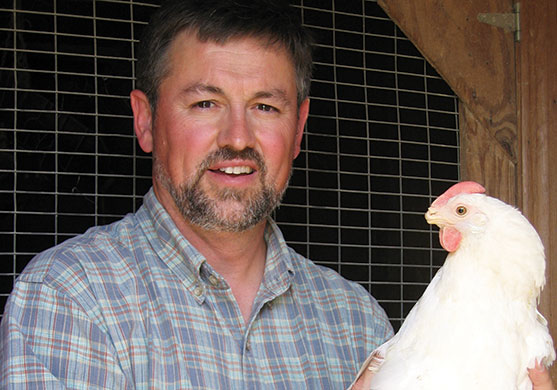 Wallace Berry holding a chicken